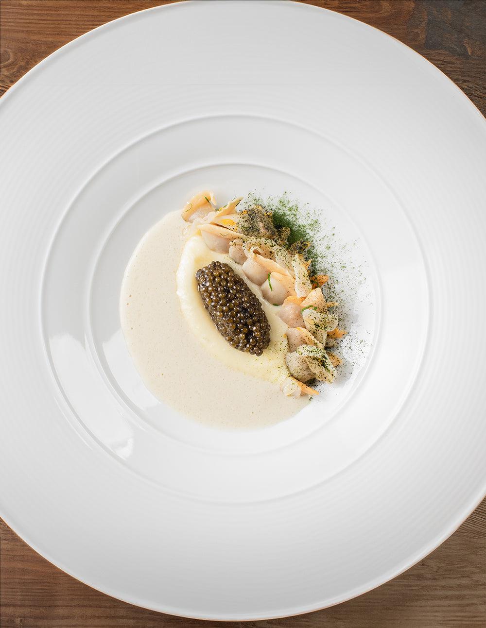 Caviar service on a white plate